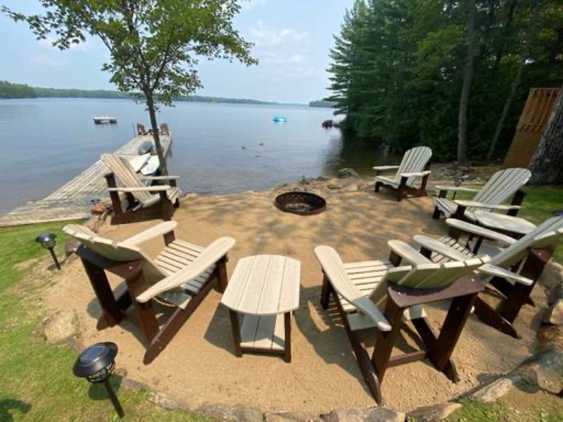 Muskoka chairs around the firepit